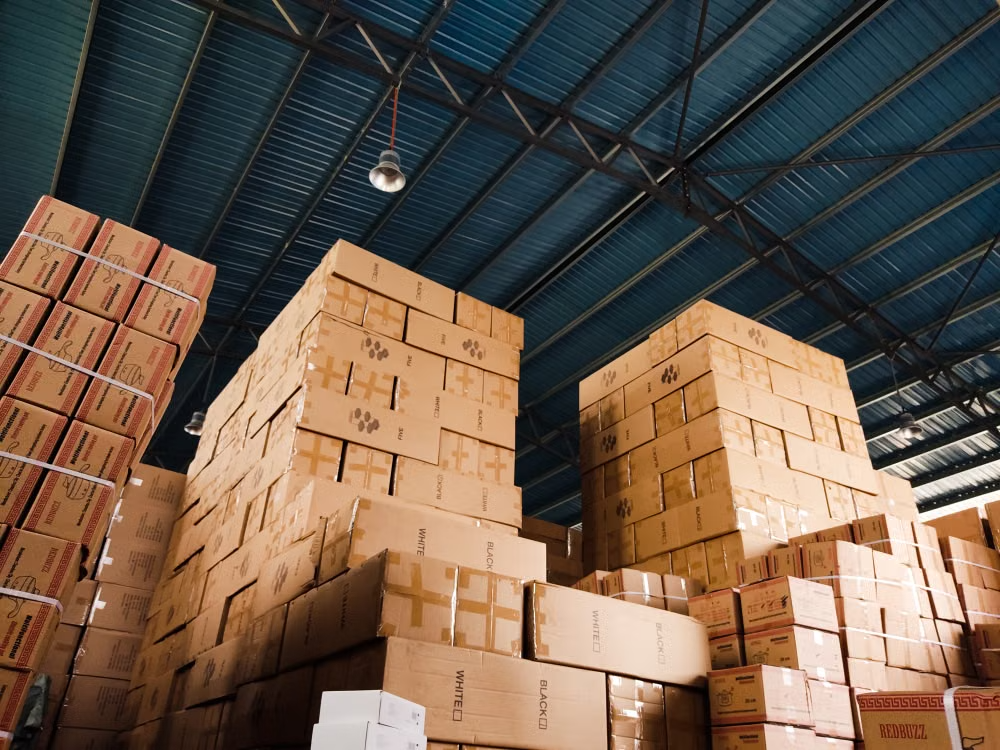 Stacked inventory boxes in a warehouse
