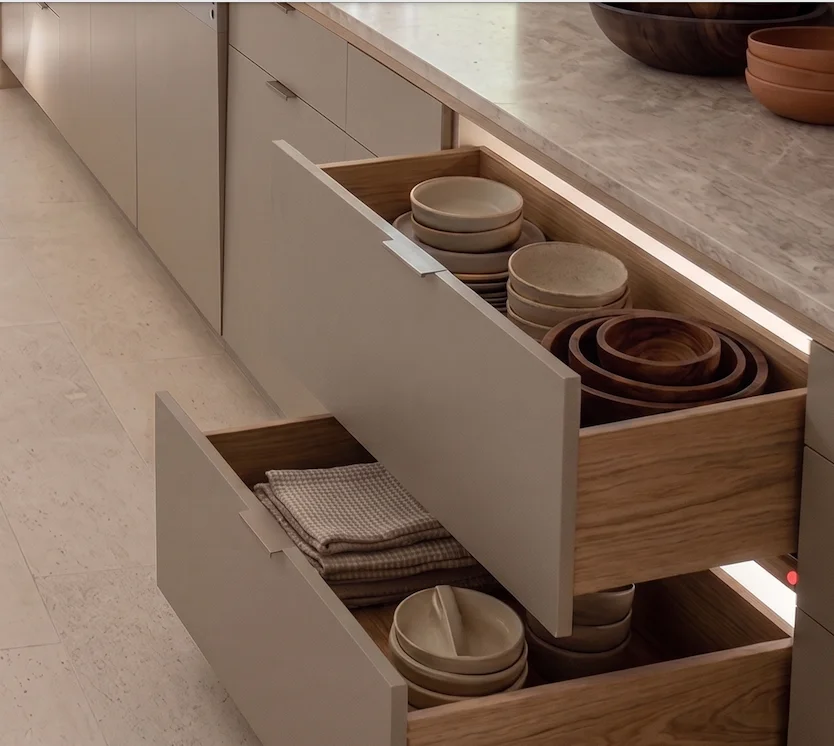 Hidden drawer slides used in a multi-drawer cabinet